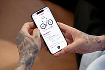 Screenshot mit Ladezeit-Anzeige in der «eBike Flow App».